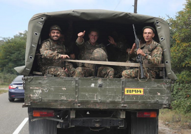 ethnic armenian soldiers react as they ride in the back of a truck in the breakaway region of nagorno karabakh september 29 photo reuters file ethnic armenian soldiers react as they ride in the back of a truck in the breakaway region of nagorno karabakh september 29 photo reuters file