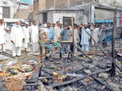 restrictions demanded after murder demonstrators burn shops of afghan businessmen want refugees out