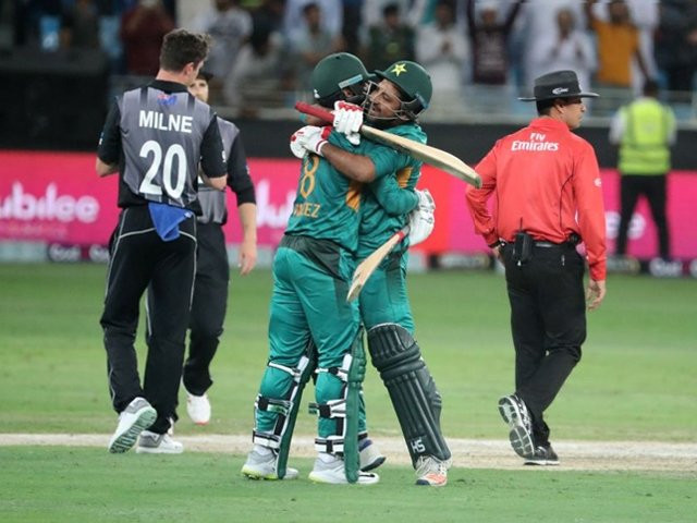 mohammed hafeez r and sarfraz ahmed l celebrate with team mates at the end of t20 cricket cricket match between pakistan and new zealand in dubai on november 2 2018 photo getty