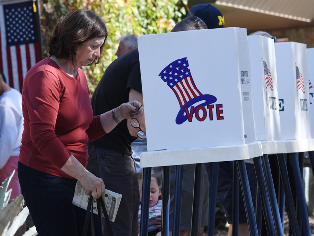 people vote at outdoor booths during early voting for the mid term elections in pasadena california on november 3 2018 photo afp