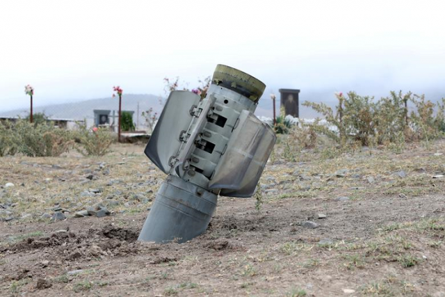 the remains of a rocket shell are seen near a graveyard at the town of ivanyan khojaly in the breakaway region of nagorno karabakh october 1 photo reuters the remains of a rocket shell are seen near a graveyard at the town of ivanyan khojaly in the breakaway region of nagorno karabakh october 1 photo reuters