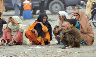 washed away families wait for the sea to throw back bodies to the shore washed away families wait for the sea to throw back bodies to the shore