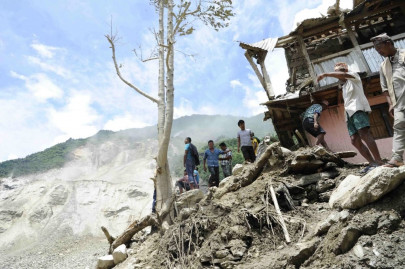 nepal landslide kills 8 blocking river and raising flood fears