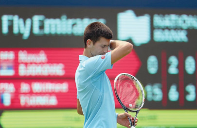 djokovic makes shock exit federer advances