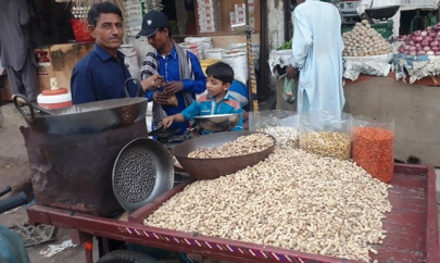 a peddler s life in the city of badin making peanuts selling peanuts
