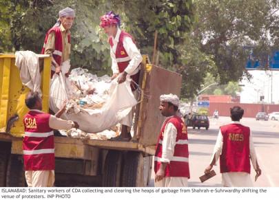 back to normal protesters move forward allowing cleaners to follow in their wake