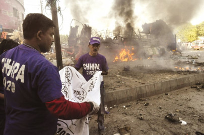 in the aftermath when death strikes rescue workers clear up the residue