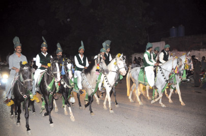 tit for tat charged pml n workers take out rally in capital