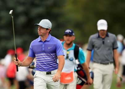 mcilroy shares early lead with spieth