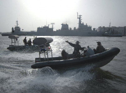two militants killed four arrested in failed attack on naval dockyard