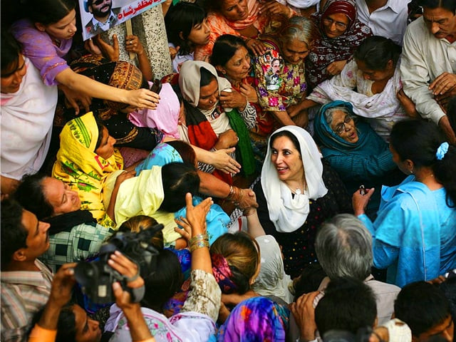 former pakistan prime minister benazir bhutto center visits the family home of zaheer abbas bolas a pakistan peoples party supporter killed in the suicide bombing aimed at assassinating bhutto in karachi in october on the outskirts of lahore pakistan on monday nov 12 2007 photo getty former pakistan prime minister benazir bhutto center visits the family home of zaheer abbas bolas a pakistan peoples party supporter killed in the suicide bombing aimed at assassinating bhutto in karachi in october on the outskirts of lahore pakistan on monday nov 12 2007 photo getty