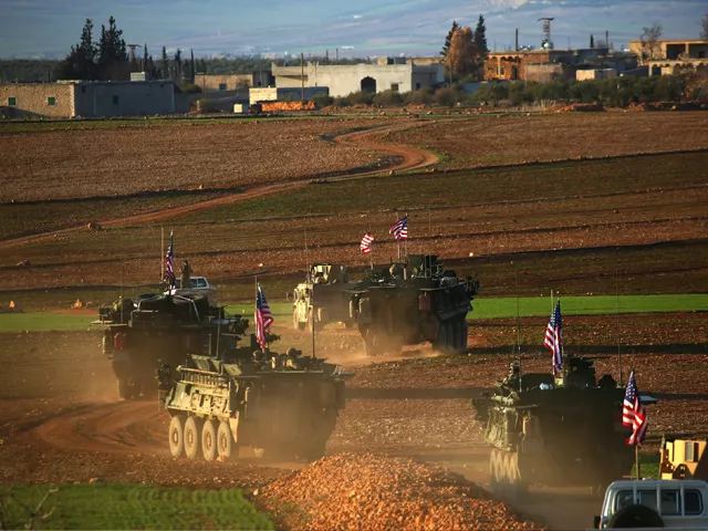a convoy of us forces armoured vehicles drives near the village of yalanli on the western outskirts of the northern syrian city of manbij on march 5 2017 photo afp a convoy of us forces armoured vehicles drives near the village of yalanli on the western outskirts of the northern syrian city of manbij on march 5 2017 photo afp