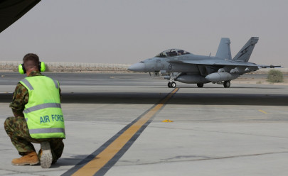 australia deploys special forces joins air strikes in iraq