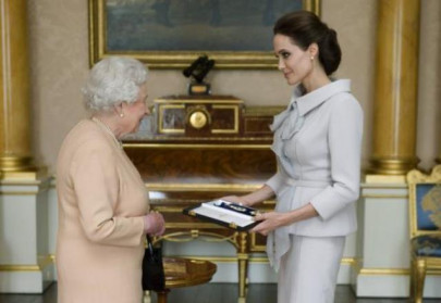 britain s queen elizabeth makes actor angelina jolie a dame