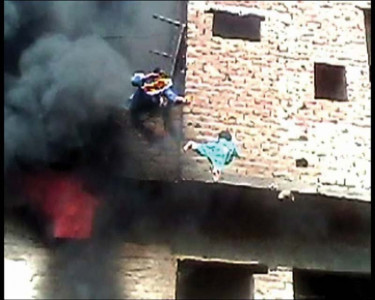 desperate measures mother hurls child to save her from fire