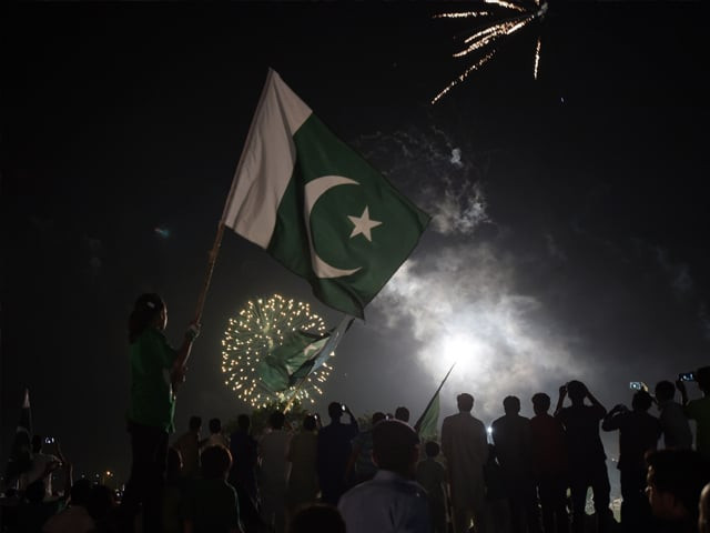 residents carry national flags as they watch fireworks in islamabad on august 14 2017 to mark independence day photo afp residents carry national flags as they watch fireworks in islamabad on august 14 2017 to mark independence day photo afp