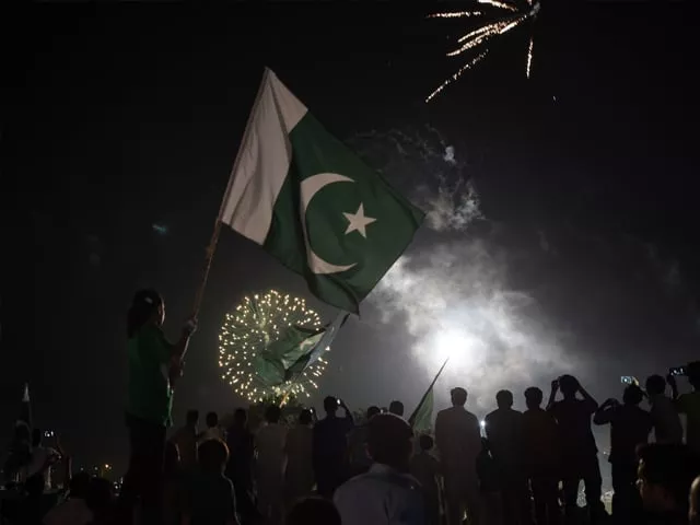 residents carry national flags as they watch fireworks in islamabad on august 14 2017 to mark independence day photo afp residents carry national flags as they watch fireworks in islamabad on august 14 2017 to mark independence day photo afp