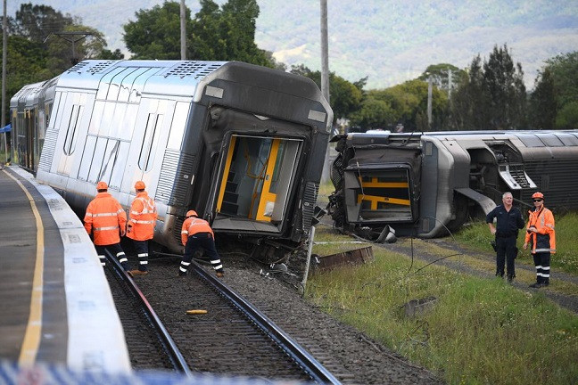 a derailed passenger train is seen after it hit a car on a level crossing in kembla grange australia october 20 2021 photo reuters