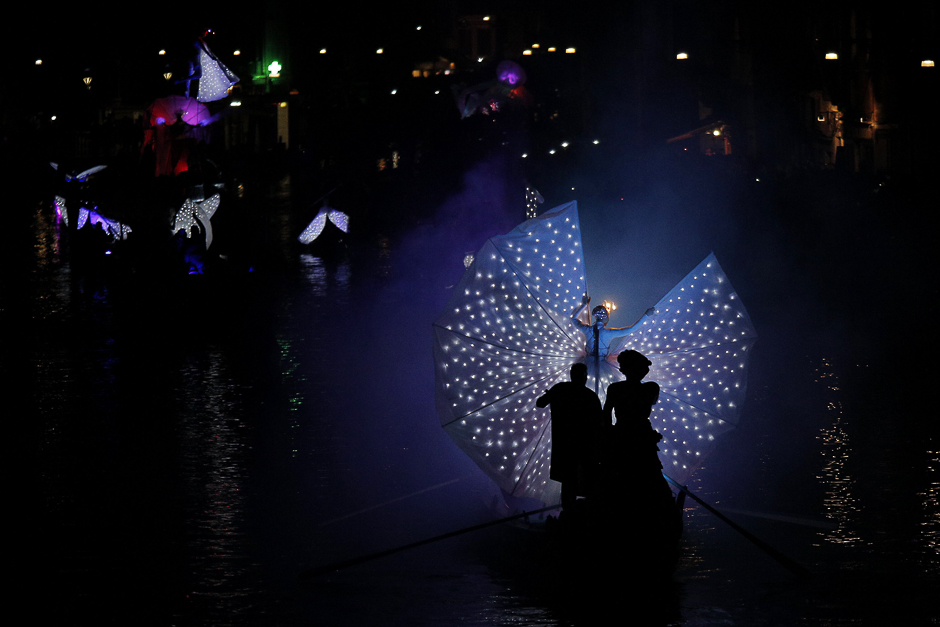 Actors perform as they sail along the Cannaregio Canal for the Carnival Regatta during the Venice Carnival in Venice. PHOTO: AFP