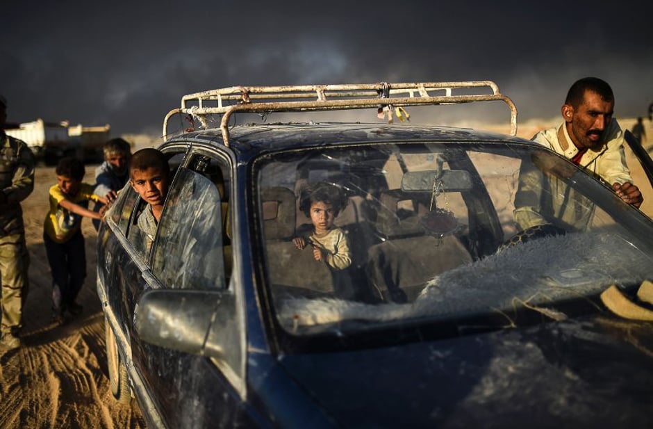 Displaced Iraqis arrive at a refugee camp in the town of Qayyarah, south of Mosul, as an operation to recapture the city of Mosul from the Islamic State, on Oct. 22, 2016. PHOTO: AFP