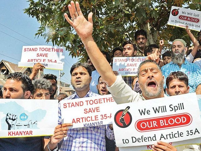 protesters shout slogans against attempts to revoke j amp k state constitution articles 35a and 370 in srinagar photo afp protesters shout slogans against attempts to revoke j amp k state constitution articles 35a and 370 in srinagar photo afp