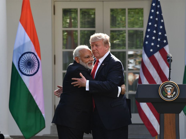 president donald trump and indian prime minister narendra modi exchanged hugs in the white house rose garden in front of reporters photo afp