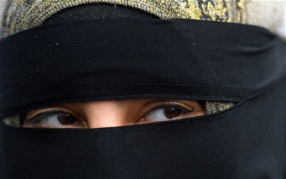 china s urumqi bans face veil sparking rights concerns