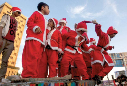 united in grief santa claus walks in solidarity with peshawar school victims