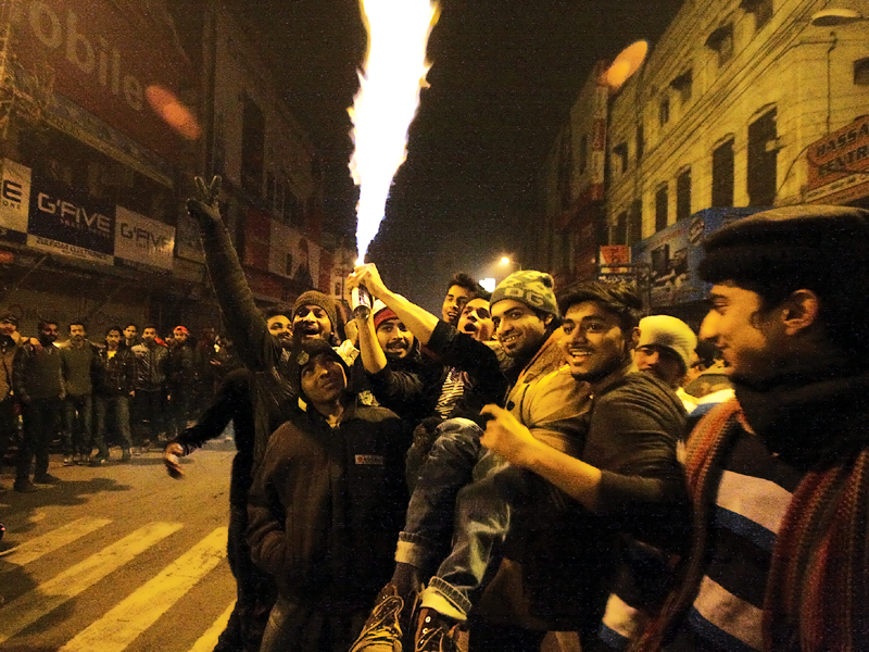 a group of boys light fireworks during new year s festivities on thursday photo abid nawaz express