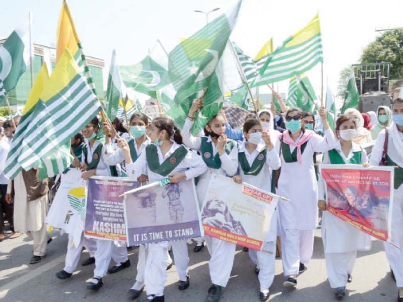 students carry kashmiri flags and posters calling to stand and speak up for kashmir during a rally on youm e istehsal at katchehri chowk in rawalpindi on wednesday photo online