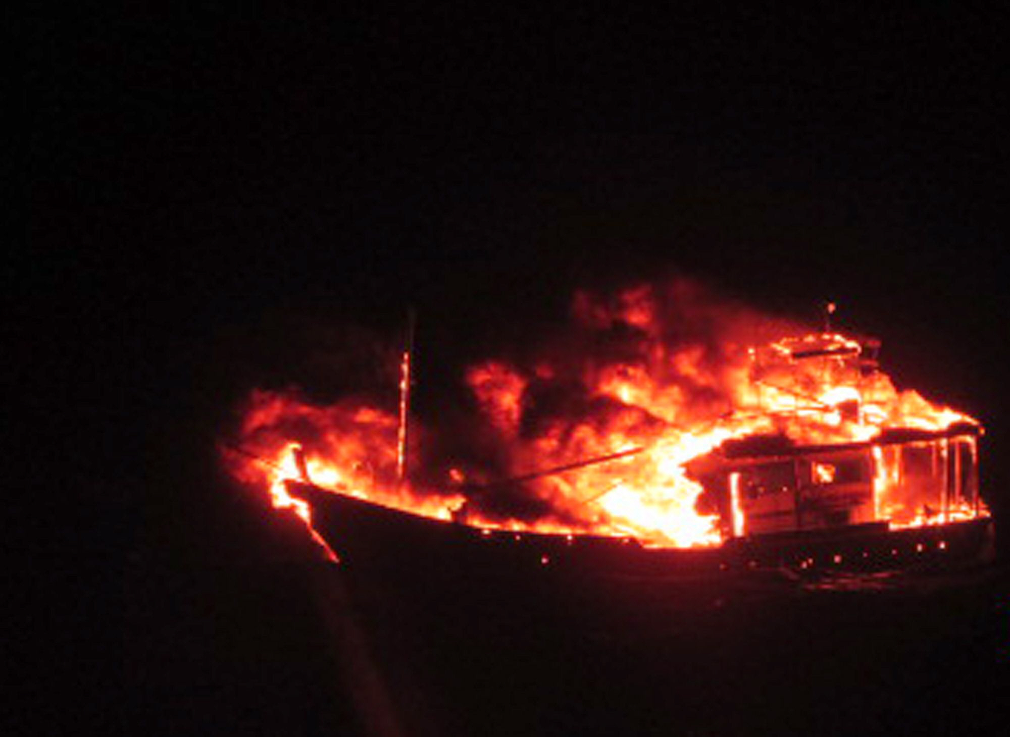this handout photograph released by the indian ministry of defence on january 2 2015 is said to show a burning vessel off the coast of the western indian state of gujarat in the arabian sea early on january 1 2015 photo afp