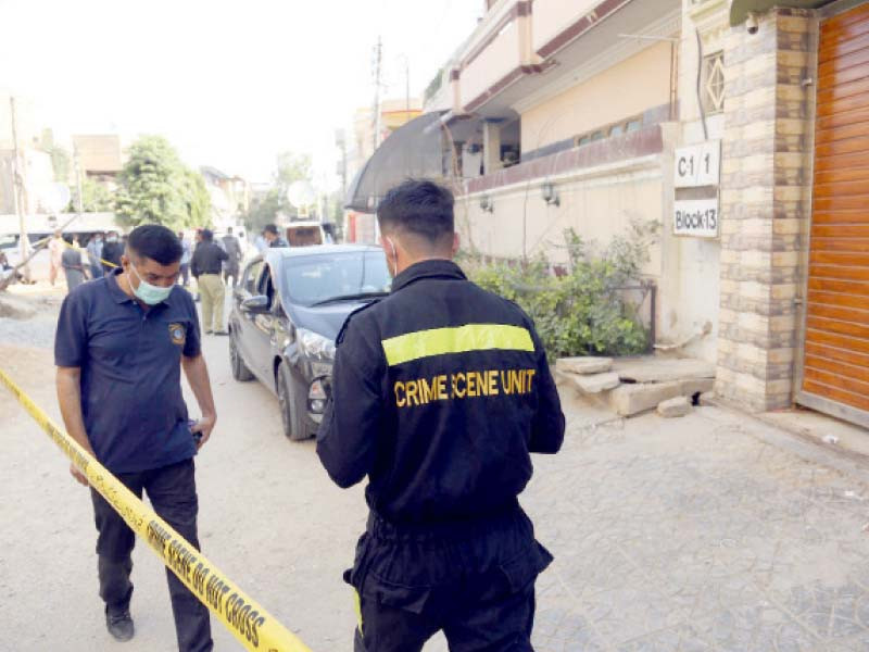 police officials collect evidence from the crime scene where sbc secretary irfan mahar was murdered photo express