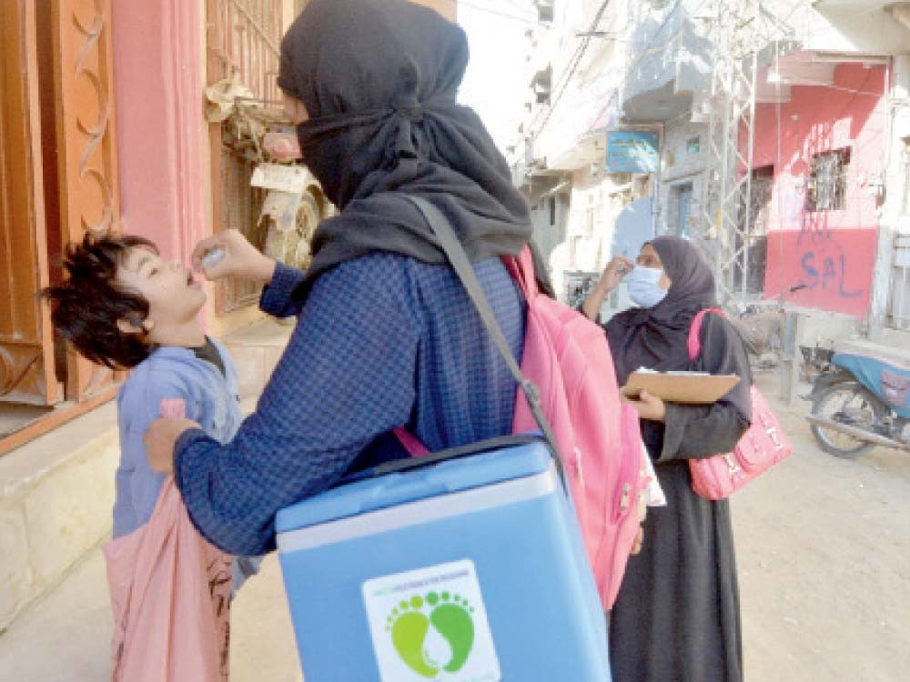 a vaccinator administers the polio vaccine to a child in the mahmoodabad area of karachi on the first day of the week long anti polio drive that kicked off on monday photo express