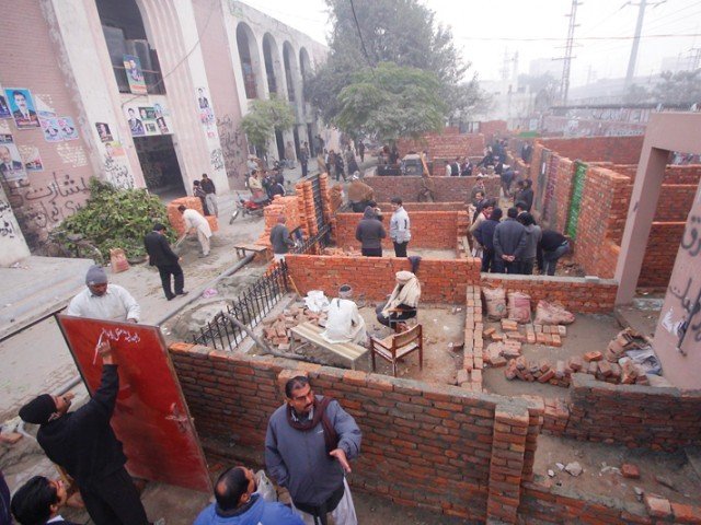 lawyers have built rooms for their chambers in the front lawn of the model town courts construction of the chambers began on saturday photo abid nawaz express