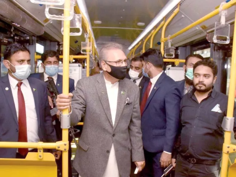 president arif alvi rides the green bus service with his staff and pti lawmakers photo express
