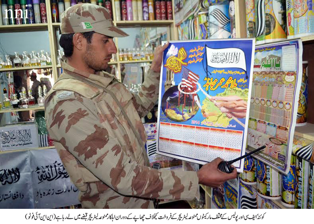 an fc official shows the material seized during a raid in quetta photo nni