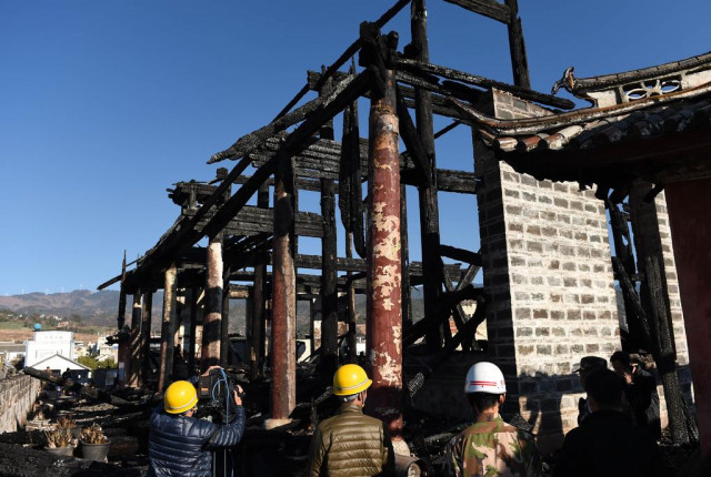 the ming dynasty tower after a fire ravaged it photo courtesy xinhua the ming dynasty tower after a fire ravaged it photo courtesy xinhua
