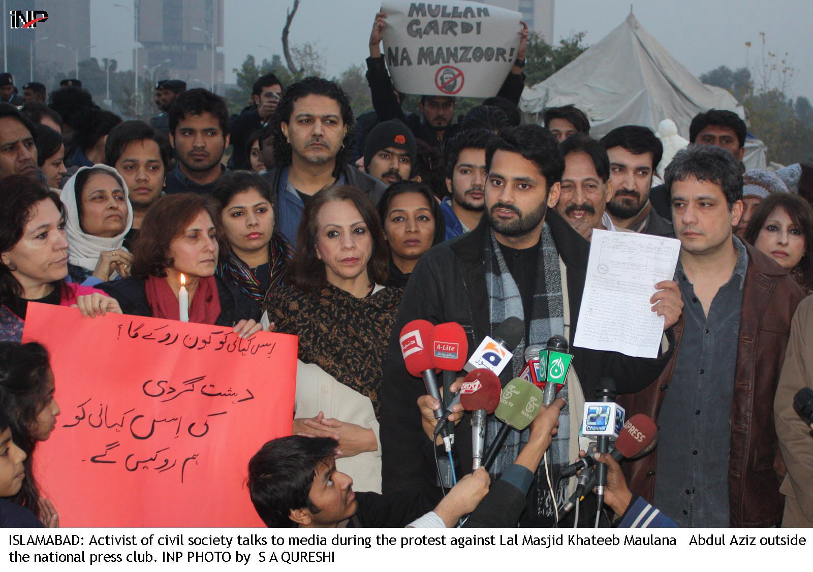 civil society activists led by m jibran nasir staged a protest against maulana abdul aziz photo inp