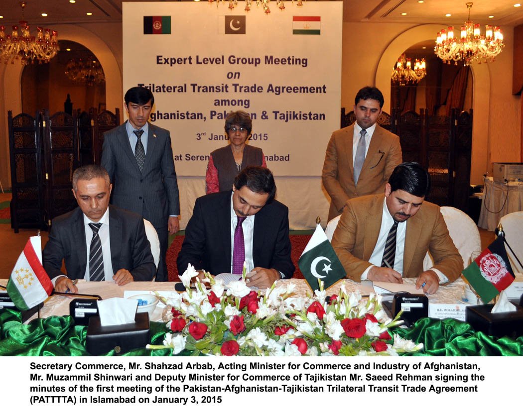 commerce secretary shahzad arbab c acting minister for commerce and industry afghanistan muzammil shinwari r deputy minister for commerce tajikistan saeed rehman l signing the minutes of the first meeting of the pakistan afghanistan tajikistan trilateral transit trade agreement in islamabad on saturday photo pid