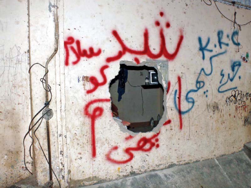 craters in walls such as these are a familiar sight in lyari residents live in constant fear of gunfire and bomb attacks by gang members photo file