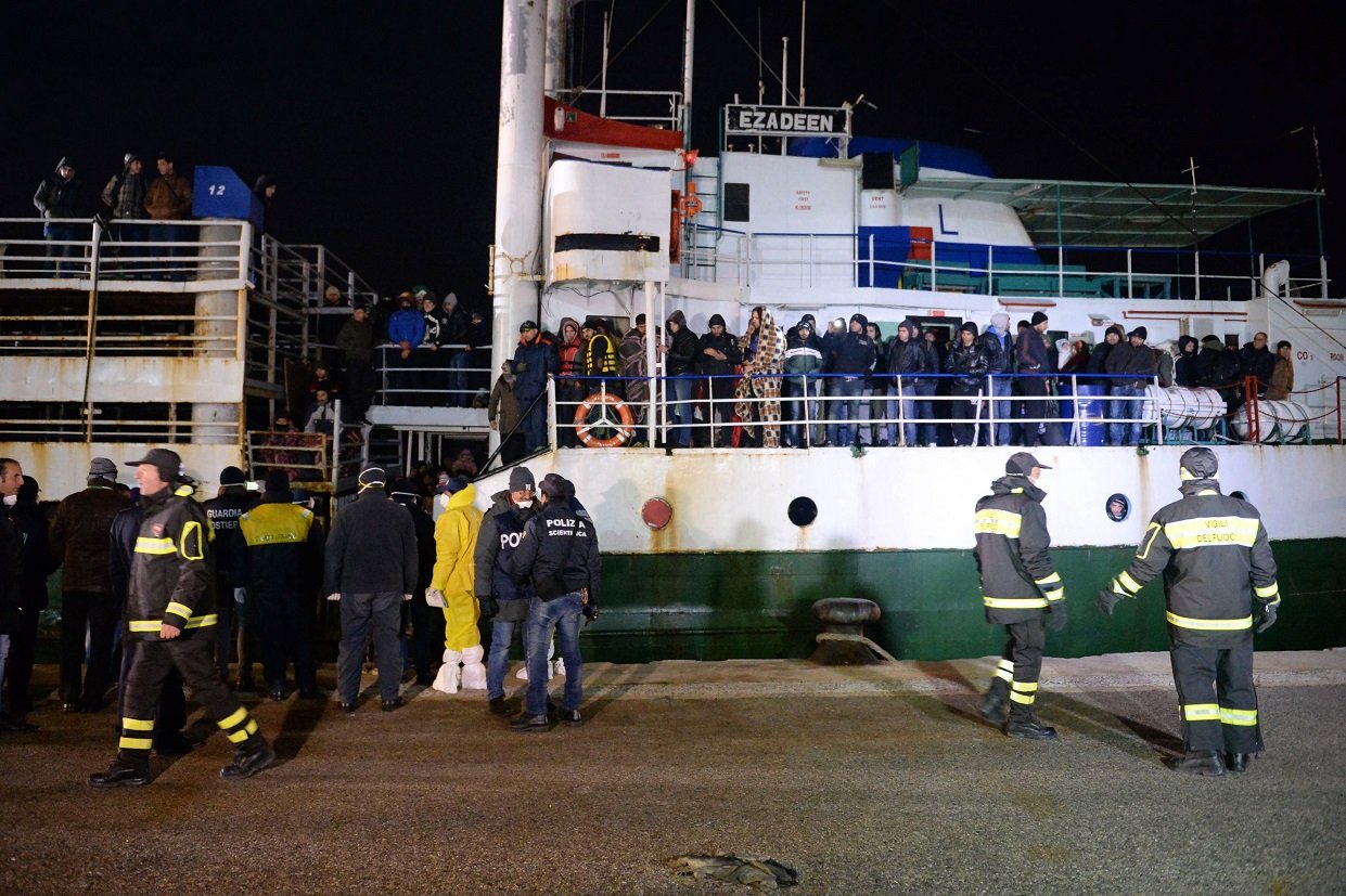 would be immigrants aboard the ezadeen ship are made to disembark at corigliano harbour on january 2 2015 photo afp