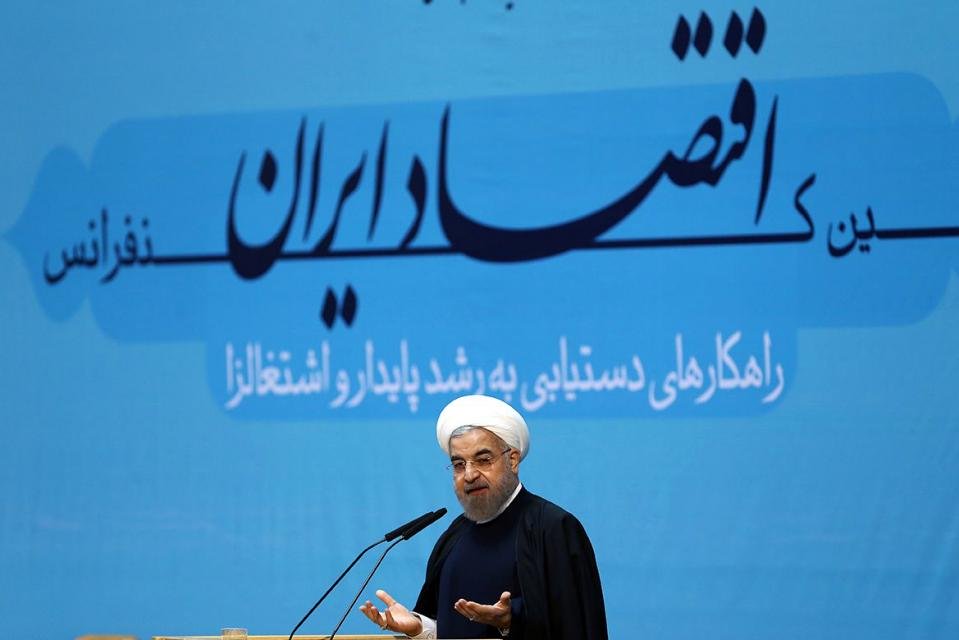 picture released by the official website of the iranian president hassan rouhani shows him speaking during the opening ceremony of the economic conference in tehran on january 4 2015 photo afp