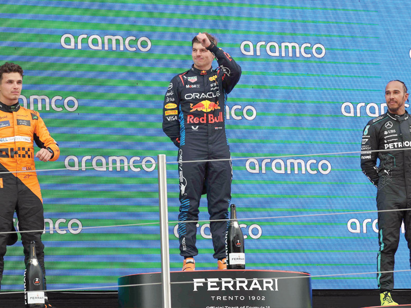 l to r mclaren s british driver lando norris red bull s dutch driver max verstappen and mercedes british driver lewis hamilton stand on the podium after the spanish formula one grand prix at the circuit de catalunya photo afp