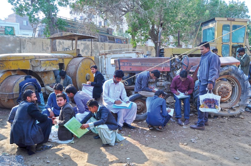 the sindh works and services department allowed thousands of candidates appearing for the bps 1 to bps 5 and bps 5 to bps 14 posts to cheat during the test on monday photo express