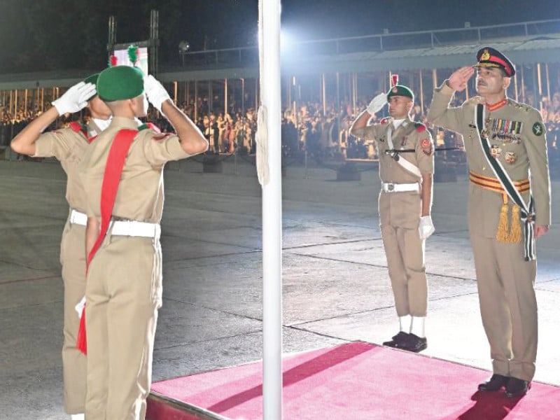 coas gen asim munir salutes after hoisting the national flag in kakul photo express