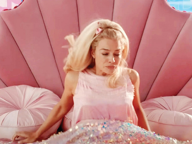 never hit the snooze button instead set multiple alarms a few minutes apart it helps if you imagine rising out of bed like margot robbie in barbieland photo file never hit the snooze button instead set multiple alarms a few minutes apart it helps if you imagine rising out of bed like margot robbie in barbieland photo file