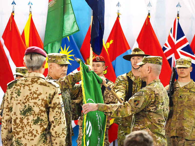 us general john campbell commander of the nato led international security assistance force folds the isaf flag during the change of mission ceremony in kabul photo afp