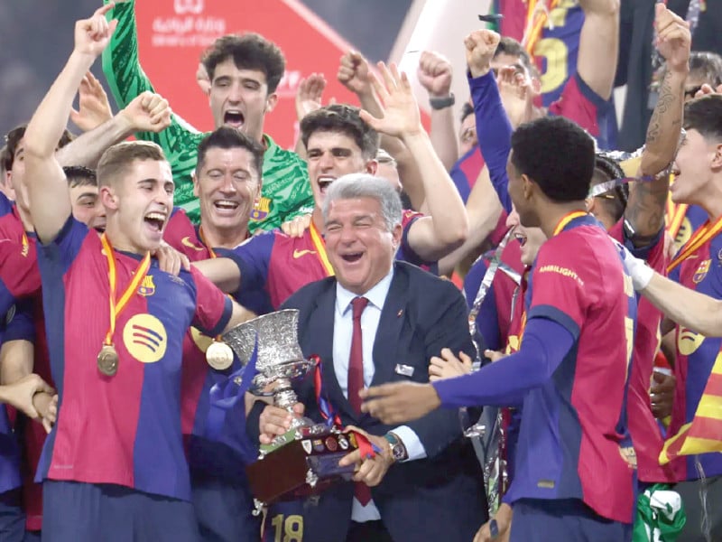 barcelona celebrate their spanish super cup victory over real madrid photo afp