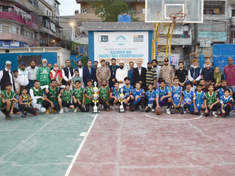 chief guest lieutenant colonel amanullah faiz is seen with the karachi district south basketball team who won the kashmir day rangers cup on sunday asad shakir ghulam mohammad and other dignitaries are also seen photo kba