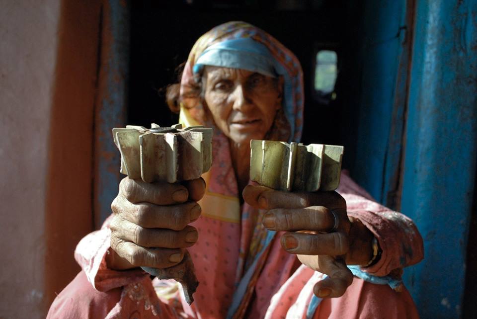 in this file photo a woman displays mortar shrapnel allegedly fired across the line of control loc between pakistan and india in the kotli sector of azad kashmir on october 8 2014 photo afp